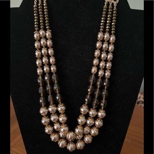 Golden tan triple strand faux pearls and crystal